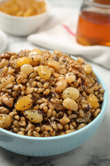 Traditional Christmas slavic dish kutia served on white marble table, closeup