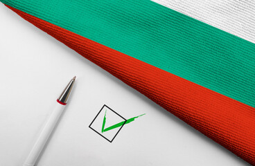 Pencil, Flag of Bulgaria and check mark on paper sheet
