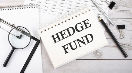 HEDGE FUND . Text written on notepad with office tools and documents.