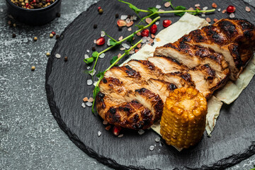 grilled chicken fillet. Barbecued chicken breasts on slate plate, Roasted Chicken fillet with vegetables, Keto breakfast or lunch. banner, catering menu recipe place for text