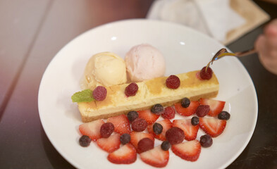 Cake with rasberry,Blue berry and strawberry with ice cream ball in plate