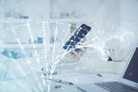 Double exposure of man's hands holding and using a phone and DNA drawing. Medical education concept.