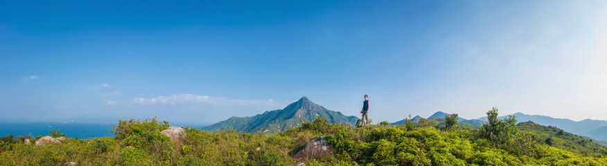 Fototapeta na wymiar Panorama of Man hiking in mountain, Autumn, Sai Kung..