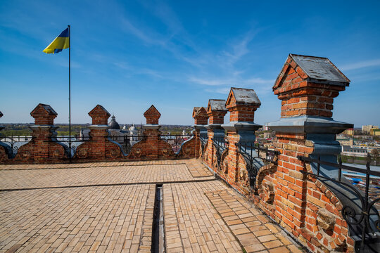 Renaissance merlons and Ukrainian flag on the top of Lubart's Tower of Lutsk Castle, Lutsk, Ukraine.