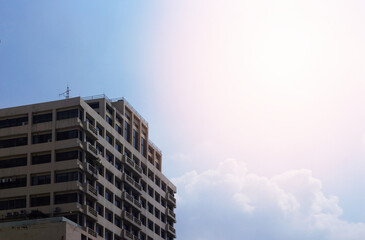Fototapeta premium generic tower or apartment on blue sky background
