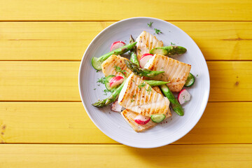 Delicious fish fillet and fresh vegetables served for lunch - obrazy, fototapety, plakaty