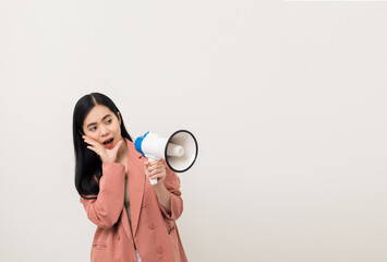 Shout out loud with megaphone. Young beautiful asian woman  announces with a voice about promotions and advertisements for products at a discounted price. Standing on isolated white background.