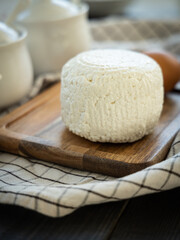 Cottage cheese on a wooden board.