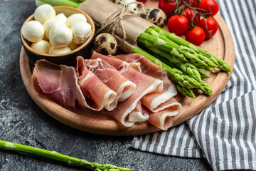 prosciutto with mozzarella cheese and cherry tomatoes. healthy food concept. Long banner format, top view