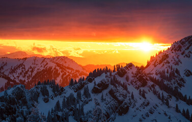 Beautiful sunset over snowy mountains in winter. Allgau Alps, Bavaria, Germany, Europe