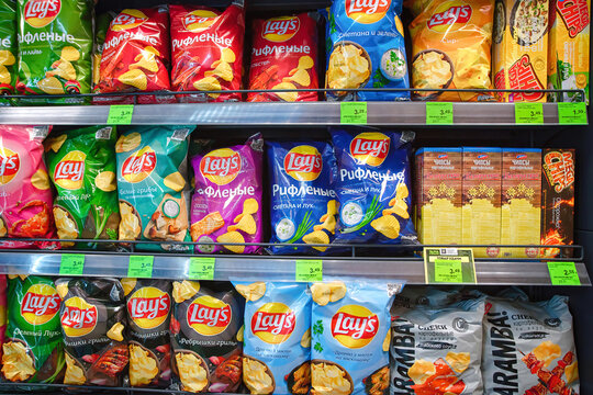 Minsk, Belarus. Mar 2022. Lay`s snacks variety packs on shelf of grocerie store. Lays potato bags, crisp chip on display at an aisle in supermarket. Potato chips selection. Lays brand owned by PepsiCo