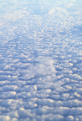 Incredible sea of clouds view from the plane window during flight