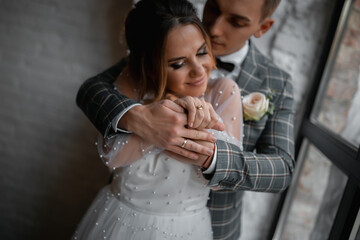 Stylish happy newlyweds, elegant satisfied bride. Newlyweds gathering