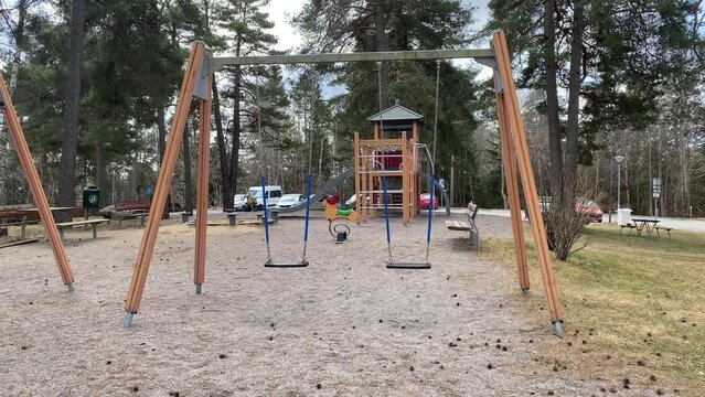 Empty playground with rocking swings