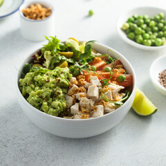 Healthy bowl with chicken and avocado