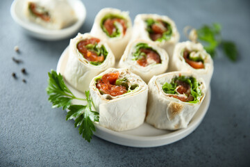 Homemade salmon wraps with fresh salad