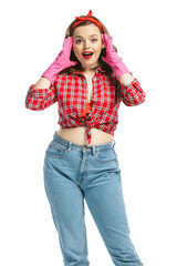 Excited young pretty girl, housewife wearing homewear in 70s, 80s fashion style smiling isolated on...