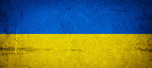 Ukrainian flag background banner panorama - Old rustic damaged concrete stone wall texture...