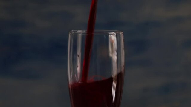 close-up pouring turnip juice into glass
