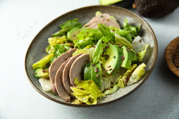 Healthy green salad with chicken and avocado