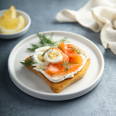 Salmon toast with quail eggs and dill
