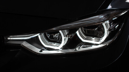 Obraz na płótnie Canvas Modern car headlights close up.