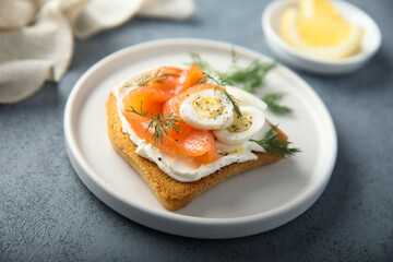 Salmon toast with quail eggs and dill