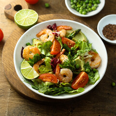 Healthy green salad with shrimps and avocado