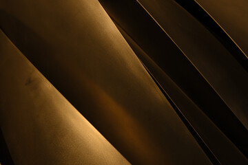 Stainless metal industrial matallic dark abstract background for modern design in warm light