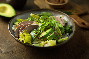 Healthy green salad with chicken and avocado