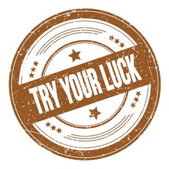TRY YOUR LUCK text on brown round grungy stamp.