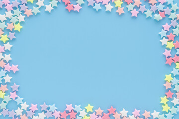 The stars in various colors on the blue background