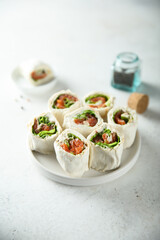 Homemade salmon wraps with fresh salad