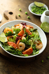 Healthy green salad with shrimps and avocado