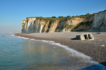 Cliffs and blockhouse on the pebble beach of Pourville, commune in the Seine-Maritime department in...