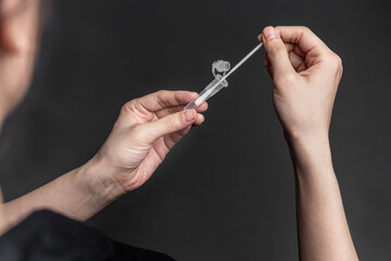 Close up of a person using coronavirus covid-19 rapid antigen home test
