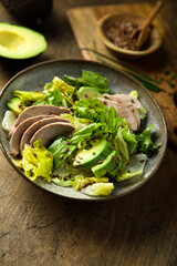 Healthy green salad with chicken and avocado