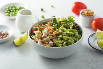 Healthy bowl with chicken and avocado