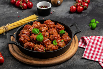 Traditional spicy meatballs in sweet and sour tomato sauce. Restaurant menu, dieting, cookbook recipe top view