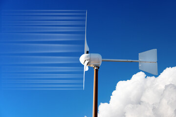 Obraz premium Close-up of a small white wind turbine, against a clear blue sky with clouds, wind and copy space. Renewable energy concept.