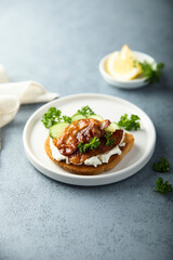 Homemade bacon sandwich with cream cheese and cucumber