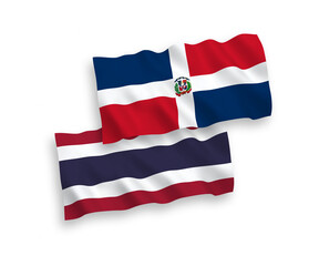National vector fabric wave flags of Dominican Republic and Thailand isolated on white background. 1 to 2 proportion.