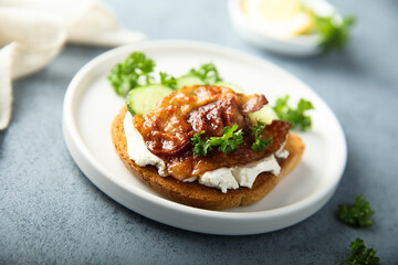 Homemade bacon sandwich with cream cheese and cucumber