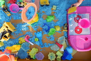 children's creativity, kinetic sand games with various forms of mold. top view