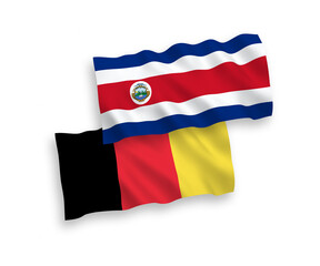 National vector fabric wave flags of Republic of Costa Rica and Belgium isolated on white background. 1 to 2 proportion.