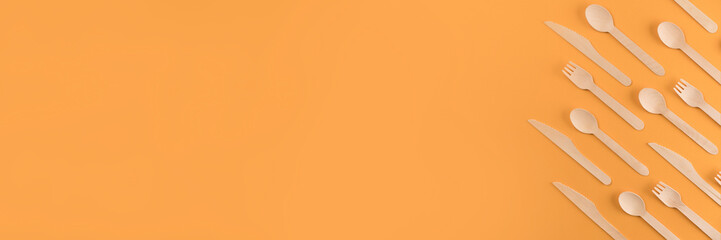 Banner with bamboo wooden cutlery set - biodegradable and compostable cutlery concept. Bamboo...