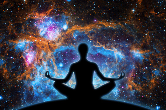 Yoga figure against  universe background with Nebula.- Elements of this image furnished by NASA