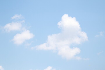Blue sky with light clouds and bright sun . Wide summer sky backdrop. Thailand