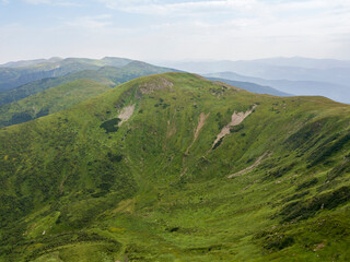 Obraz premium High mountains of the Ukrainian Carpathians in cloudy weather. Aerial drone view.