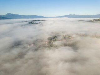 Morning fog in the Ukrainian Carpathians. Aerial drone view.